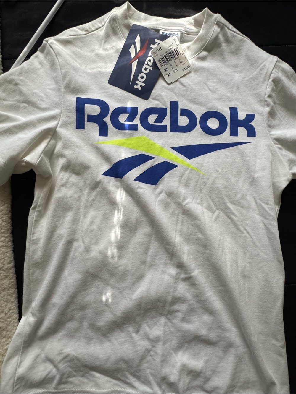 Reebok Men’s White Tee with Blue Logo and Neon Accent